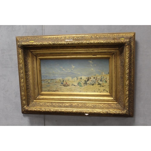 31 - A GILT FRAMED OIL ON BOARD OF A BEACH SCENE WITH FIGURES - H 19 CM BY W 39 CM