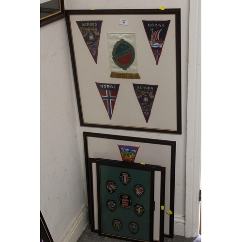 43 - A QUANTITY OF FRAMED AND GLAZED PATCHES AND PENDANTS