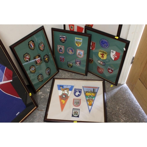 43 - A QUANTITY OF FRAMED AND GLAZED PATCHES AND PENDANTS