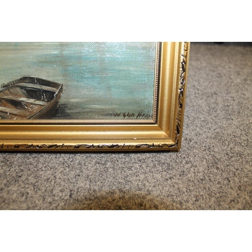 9 - A GILT FRAMED OIL ON CANVAS OF A HARBOUR SCENE WITH BOATS SIGNED W GLYN HEARD LOWER RIGHT