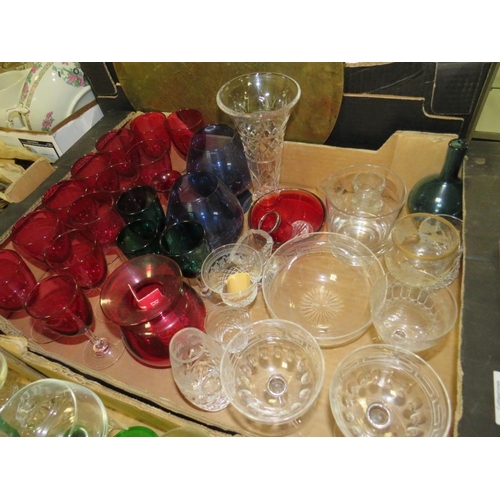 132 - FOUR TRAYS OF ASSORTED GLASSWARE TO INCLUDE A QUANTITY OF CUT GLASS DRINKING GLASSES, COLOURED GLASS... 