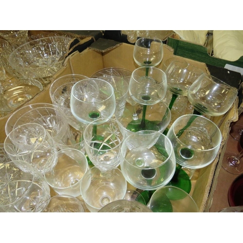 132 - FOUR TRAYS OF ASSORTED GLASSWARE TO INCLUDE A QUANTITY OF CUT GLASS DRINKING GLASSES, COLOURED GLASS... 