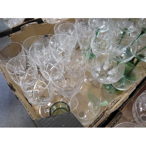 132 - FOUR TRAYS OF ASSORTED GLASSWARE TO INCLUDE A QUANTITY OF CUT GLASS DRINKING GLASSES, COLOURED GLASS... 