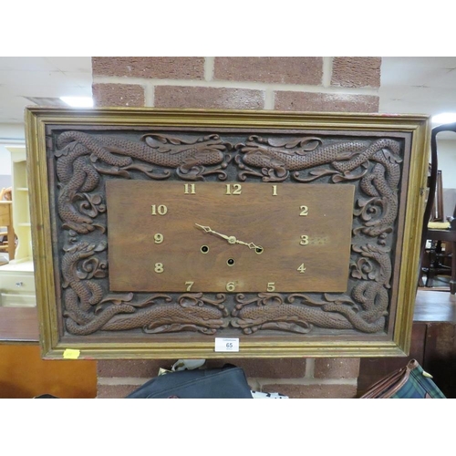 65 - A RECTANGULAR WESTMINSTER CHIME WALL CLOCK WITH HAND CARVED DRAGON FRIEZE