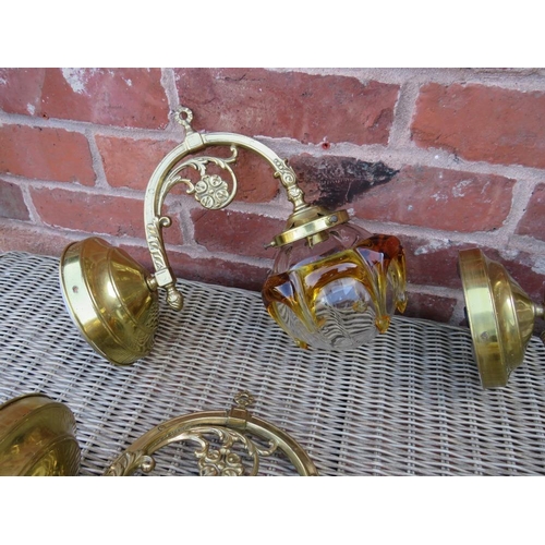 68 - A SET OF FOUR BRASS EFFECT WALL LIGHT FITTINGS WITH RETRO GLASS SHADES