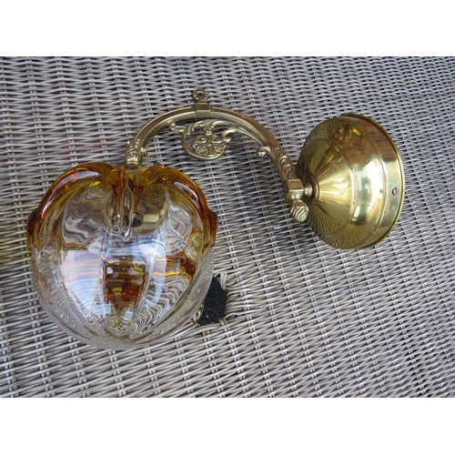 68 - A SET OF FOUR BRASS EFFECT WALL LIGHT FITTINGS WITH RETRO GLASS SHADES