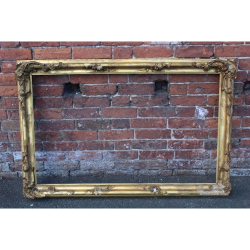 52 - A 19TH CENTURY GILT RECTANGULAR FRAME, with floral detail and acanthus moulded detail, rebate 71 x 1... 