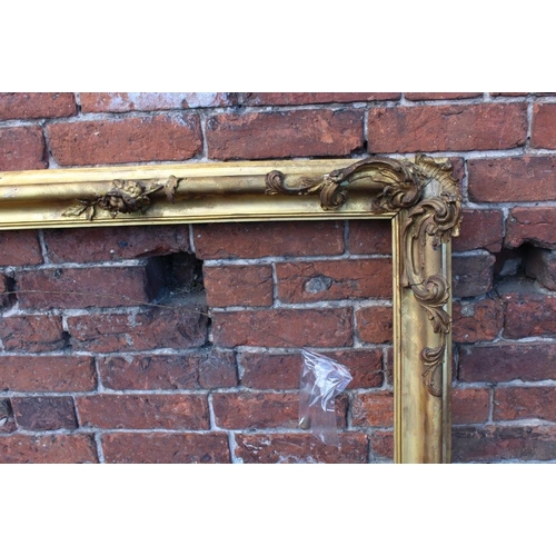 52 - A 19TH CENTURY GILT RECTANGULAR FRAME, with floral detail and acanthus moulded detail, rebate 71 x 1... 