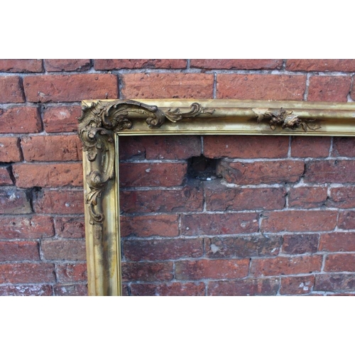 52 - A 19TH CENTURY GILT RECTANGULAR FRAME, with floral detail and acanthus moulded detail, rebate 71 x 1... 