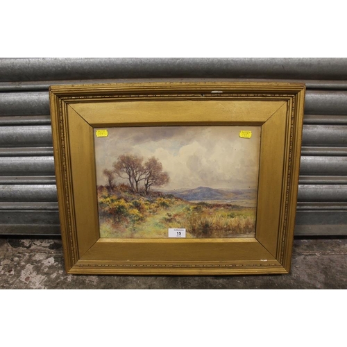 15 - A GILT FRAMED AND GLAZED WATERCOLOUR OF AN EXTENSIVE LANDSCAPE SIGNED J. CLINTON JONES 1903