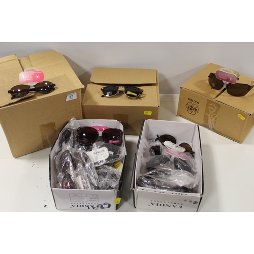 67 - FIVE BOXES OF PACKAGED SUN GLASSES