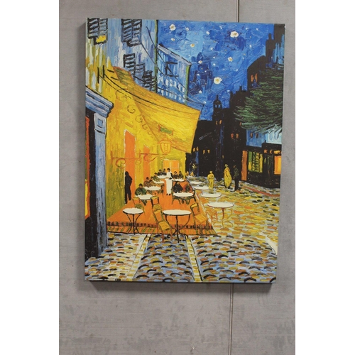 18 - A LARGE CANVAS PRINT OF AN IMPRESSIONIST PAINTING OF A STREET CAFE SCENE - H 125 CM W 76.5 CM