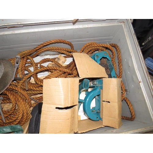 565 - A LARGE STEEL FRAMED TRAVELLING TRUNK WITH ROPE, CROWBAR ETC