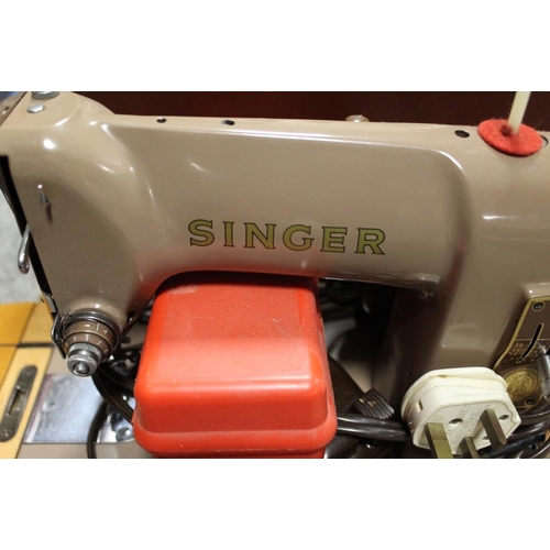 142 - A CASED SINGER SEWING MACHINE