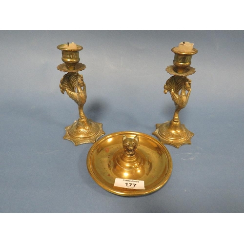 177 - A PAIR OF EASTERN BRASS PEACOCK CANDLESTICKS TOGETHER WITH A FOX HEAD CIRCULAR DISH