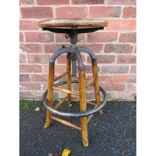 604 - AN INDUSTRIAL STYLE WOOD AND CAST STOOL