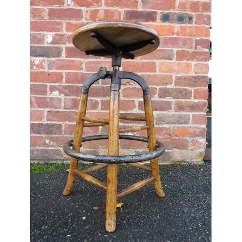 604 - AN INDUSTRIAL STYLE WOOD AND CAST STOOL