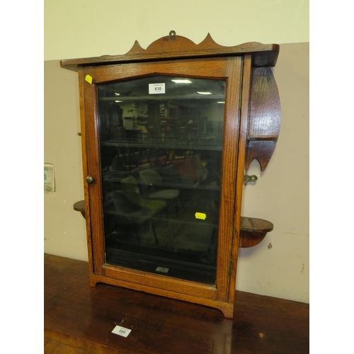 610 - AN OAK GLAZED WALL HANGING CABINET W-54 CM