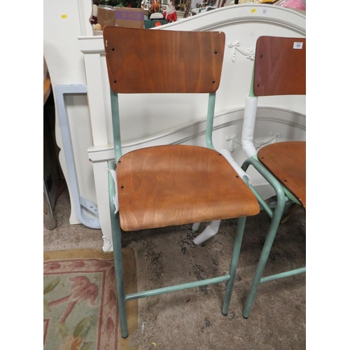 659 - A HARLEQUIN SET OF SIX INDUSTRIAL STYLE METAL BAR STOOLS