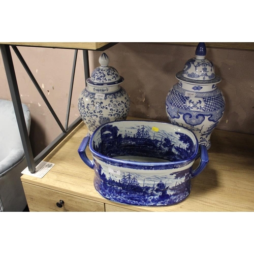 99 - TWO MODERN LARGE ORIENTAL STYLE BLUE AND WHITE LIDDED GINGER JARS TOGETHER WITH A FOOTBATH