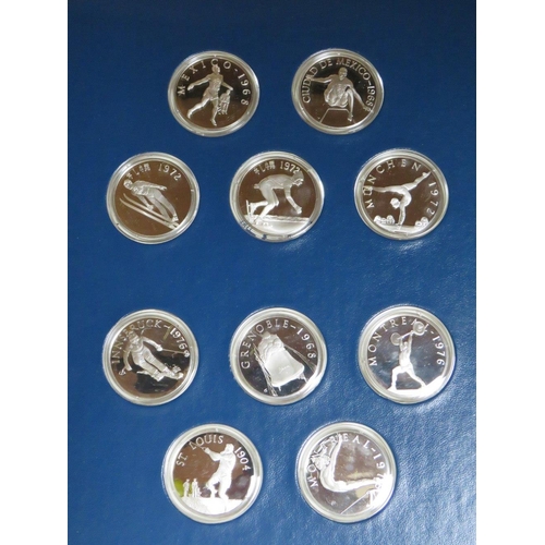 231 - THE OFFICIAL HISTORY OF THE OLYMPIC GAMES LIMITED EDITION SOLID SILVER PROOF SET CONTAINING FIFTY CA... 