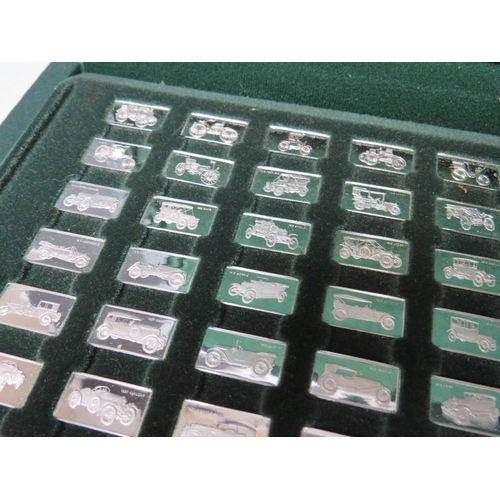 241 - A CASED SET OF 100 MINIATURE SILVER CAR DESIGN INGOTS STAMPED 925 / 1000