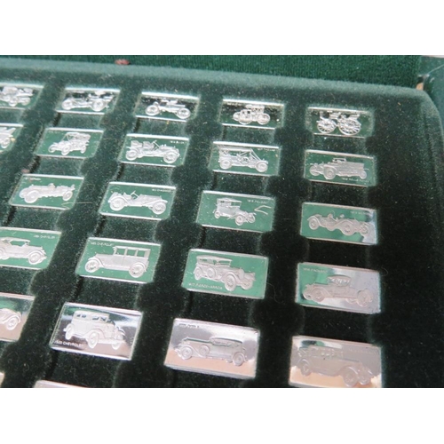 241 - A CASED SET OF 100 MINIATURE SILVER CAR DESIGN INGOTS STAMPED 925 / 1000