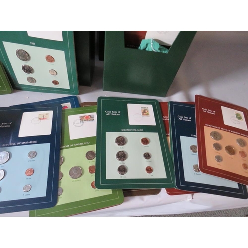 243 - FOUR EMBOSSED VOLUMES OF THE COIN SETS OF ALL NATIONS CONTAINING 'FRESH SETS OF CIRCULATING COINAGE ... 