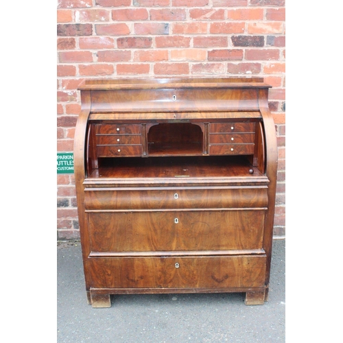 605 - A 19TH CENTURY BIEDERMEIER STYLE MAHOGANY CYLINDER BUREAU HAVING A FITTED INTERIOR,  the pull-out wr... 