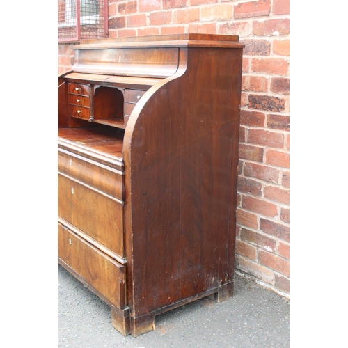 605 - A 19TH CENTURY BIEDERMEIER STYLE MAHOGANY CYLINDER BUREAU HAVING A FITTED INTERIOR,  the pull-out wr... 