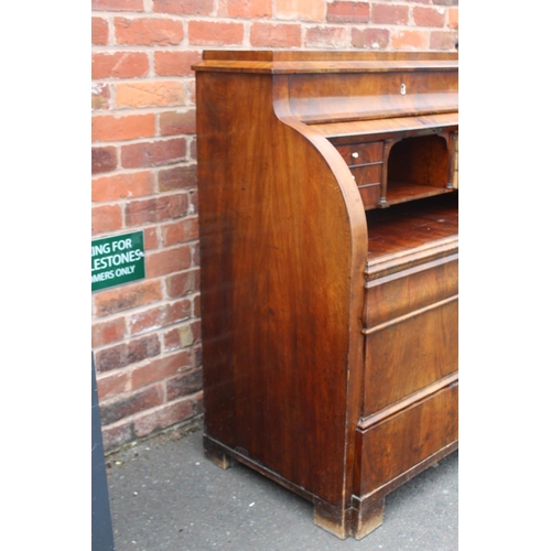 605 - A 19TH CENTURY BIEDERMEIER STYLE MAHOGANY CYLINDER BUREAU HAVING A FITTED INTERIOR,  the pull-out wr... 