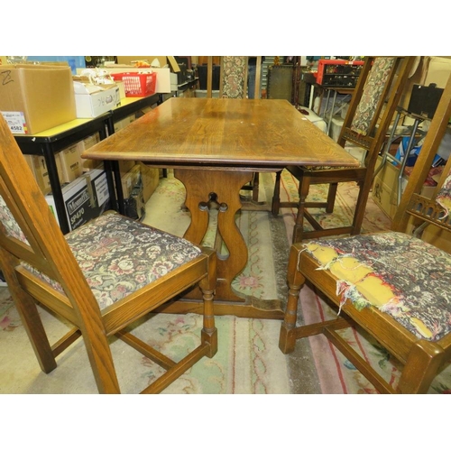 648 - AN OAK OLD CHARM REFECTORY TABLE WITH FOUR CHAIRS EACH CHAIR WITH CARVED DEDICATION TO 'HRH PRINCE C... 