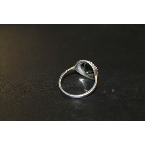 265 - A SILVER & MARCASITE GEMSET RING STAMPED 925 WITH CENTRAL GREEN STONE, APPROX 4 G, RING SIZE R