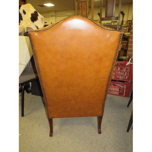 655 - AN ANTIQUE STYLE BROWN LEATHER WINGBACK ARMCHAIR