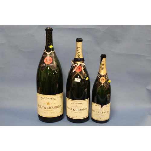 71 - A COLLECTION OF THREE ASSORTED SIZE EMPTY CHAMPAGNE DISPLAY / ADVERTISING BOTTLES