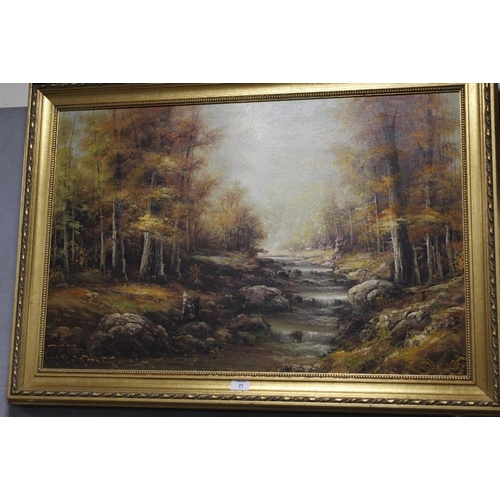 21 - A GILT FRAMED OIL ON CANVAS OF A WOODED STREAM SIGNED MIKE LOWER LEFT