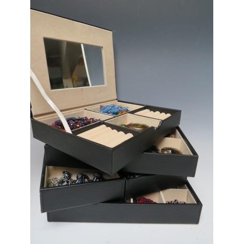 245 - A STACKING JEWELLERY BOX AND CONTENTS, comprising of approximately 40 handcrafted bead necklaces, ba... 