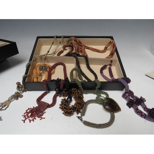 245 - A STACKING JEWELLERY BOX AND CONTENTS, comprising of approximately 40 handcrafted bead necklaces, ba... 