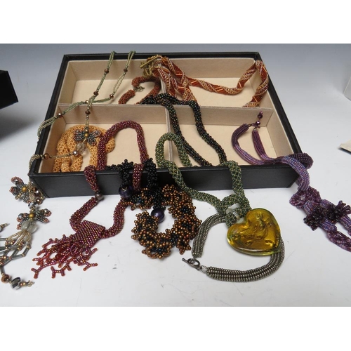 245 - A STACKING JEWELLERY BOX AND CONTENTS, comprising of approximately 40 handcrafted bead necklaces, ba... 