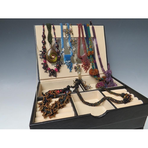 245 - A STACKING JEWELLERY BOX AND CONTENTS, comprising of approximately 40 handcrafted bead necklaces, ba... 