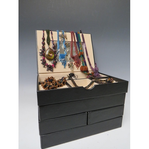 245 - A STACKING JEWELLERY BOX AND CONTENTS, comprising of approximately 40 handcrafted bead necklaces, ba... 