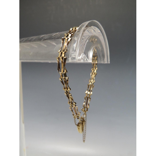 273 - A 9CT GOLD THREE BAR GATE BRACELET, marked 375 to heart shape clasp, approx weight 3.65 g