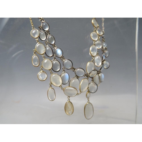 275 - A WHITE METAL AND MOONSTONE TYPE 'DROPPER' NECKLACE, together with a similar gold tone example (2)