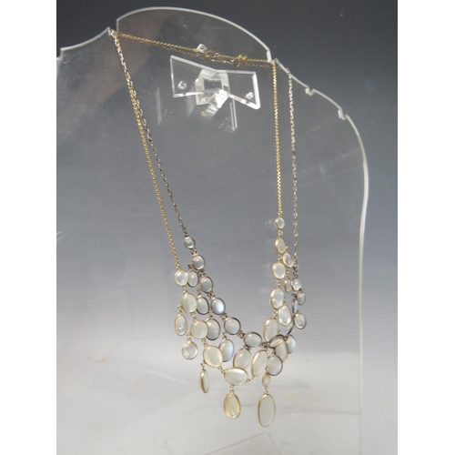 275 - A WHITE METAL AND MOONSTONE TYPE 'DROPPER' NECKLACE, together with a similar gold tone example (2)