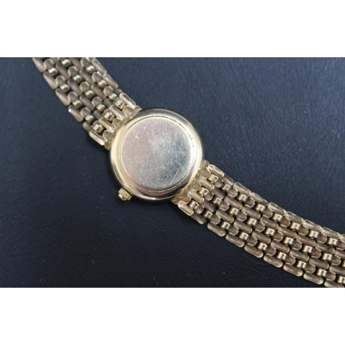 298 - A 9 CARAT GOLD SOVEREIGN DATE WRIST WATCH, approx weight 17g, Dia 2 cm