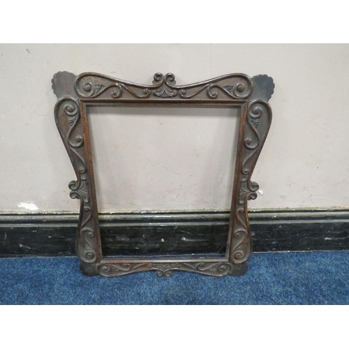 37 - A 19TH CENTURY DECORATIVE DARK HARDWOOD FRAME WITH SCROLLING, widest frame W 7.5 cm, rebate 43 x 36 ... 