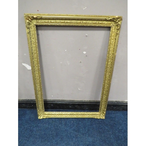 40 - A 19TH CENTURY DECORATIVE GOLD FRAME WITH CORNER EMBELLISHMENTS, with some restoration, frame W 9.5,... 