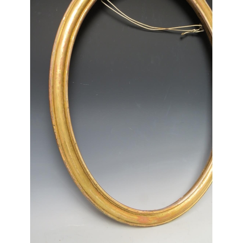 48 - A 19TH CENTURY OVAL GOLD FRAME, frame W 4 cm, rebate 62 x 47 cm