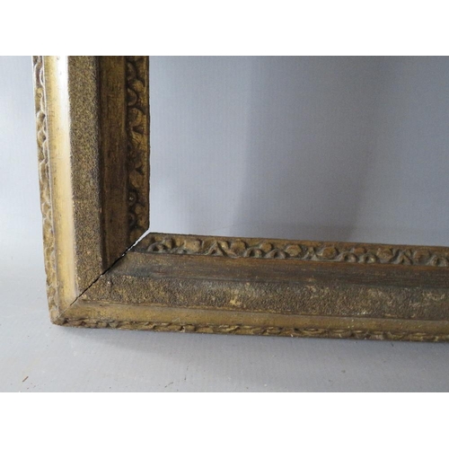 63 - A 19TH CENTURY GOLD FRAME, with designs to inner and outer edges, in need of some restoration, frame... 