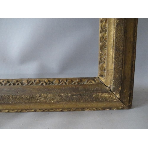 63 - A 19TH CENTURY GOLD FRAME, with designs to inner and outer edges, in need of some restoration, frame... 